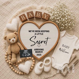 May include: A heart-shaped announcement board with the text "We've been keeping a little secret arriving March 2025." The image includes a teddy bear, baby clothes, ultrasound image, and wooden blocks spelling "BABY."