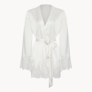 May include: A white satin robe with a lace trim. The robe has a V-neck and long sleeves. The robe is tied at the waist with a matching satin sash.