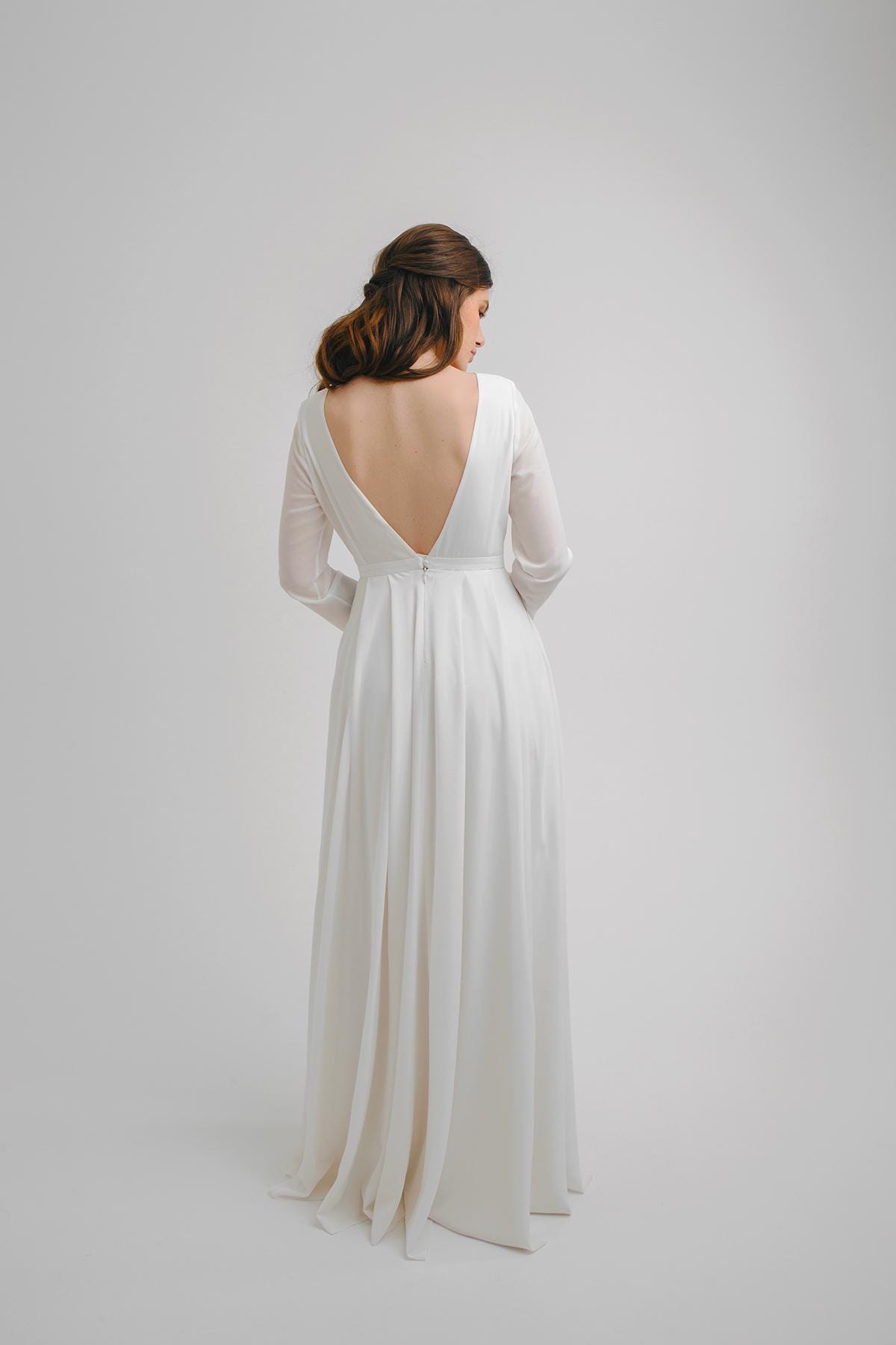 A-Line Crepe Wedding Dress: Long Sleeve Bridal Gown with Pockets A-Line Crepe Wedding Dress: Long Sleeve Bridal Gown with Pockets