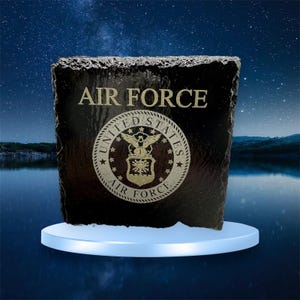 May include: Black slate coaster with a gold inscription "AIR FORCE" and the United States Air Force emblem.