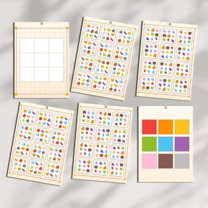 Pode incluir: Seis cartões de jogo retangulares com layouts de grade e ícones coloridos de frutas, vegetais, animais e elementos naturais. Um cartão mostra uma grade vazia, outro quadrados de cores sólidas e quatro contêm vários padrões de ícones.