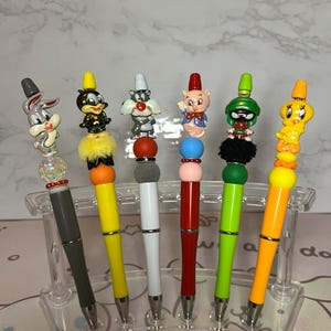 Bolígrafos de cuentas de Looney Tunes / Looney Tunes / Bolígrafos de cuentas