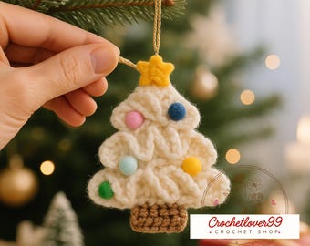 May include: Cream-colored crocheted Christmas tree ornament with colorful pom-poms and a yellow star on top. The tree has a brown crocheted base and is suspended by a gold string. The text "Crochetlover99 + Crochet Shop" is visible.