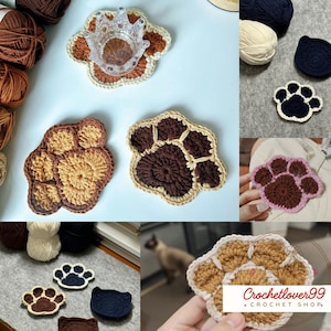 May include: A collection of handmade crochet items, including paw-shaped coasters and cat-face designs. The coasters feature brown, tan, and cream colors. Yarn balls are visible in the background. The items are from Crochetlover99 + Crochet Shop.