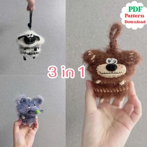 May include: Three handmade crochet animal ornaments: a sheep, a bear, and a mouse. The sheep is white and black, the bear is brown, and the mouse is blue. The image includes the text "3 in 1" and "PDF Pattern Download".