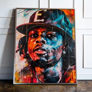 May include: A colorful portrait painting of a person wearing a blue and black baseball cap with the letter "E" on it. The person has dark skin and is looking directly at the viewer. The painting is done in a vibrant style with splashes of red, blue, and yellow paint.