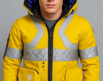 May include: A bright yellow jacket with a black zipper, silver reflective accents, and a hood with blue lights. The jacket has two front pockets and a medical symbol on the left pocket.