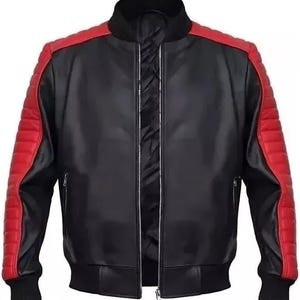 May include: Black leather jacket with red shoulder and sleeve accents. Features a ribbed collar, cuffs, and hem. The jacket has a front zipper closure and two side pockets. The sleeves have a quilted design.