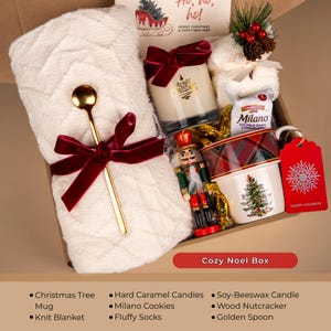 Cozy Christmas gift box with tartan mug, knit blanket, soy candle, golden spoon, Milano cookies, and nutcracker — holiday self care gift for her or festive gift basket.