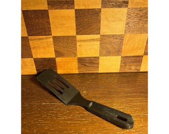Mini Black Nylon Pampered Chef Spatula, end is worn
