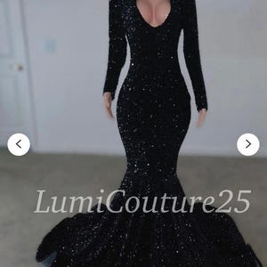 May include: A black long-sleeved sequined mermaid-style gown with a plunging neckline. The gown has a fitted bodice and a flowing skirt. The text "LumiCouture25" is visible at the bottom of the image.