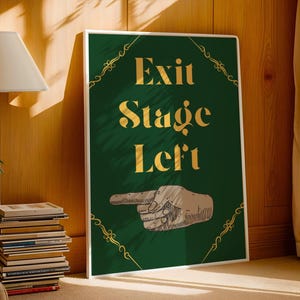 May include: A green poster with gold lettering that reads "Exit Stage Left". A gold-colored hand points to the left.