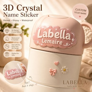 May include: A 3D crystal name sticker featuring the text Labella Lemaire in white on a pink cloud-shaped background. The sticker is glossy, raised, and waterproof. Additional small stickers include a pink heart, a pink bow, and a white daisy.