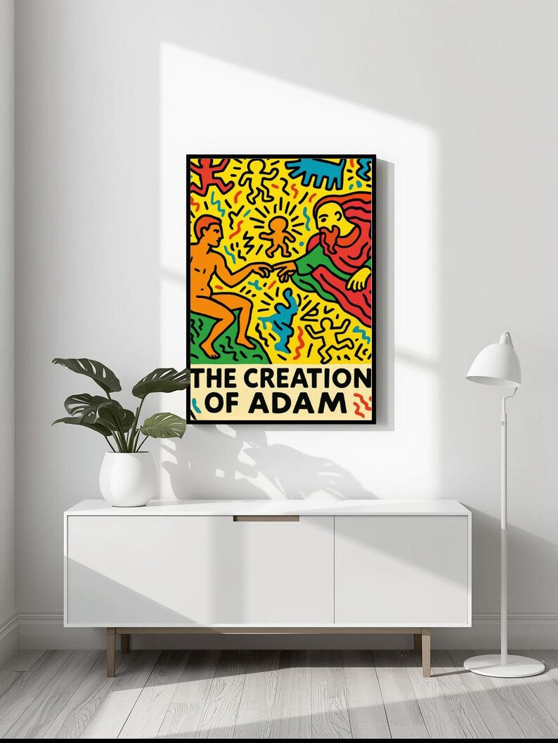 以下が含まれることがあります： 「アダムの創造」のカラフルなイラストが描かれた額入りのアートプリント。 2人の人物が手を伸ばし、鮮やかな形や模様に囲まれています。 タイトル「THE CREATION OF ADAM」が下部に太字で表示されています。
