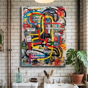 May include: Abstract art canvas depicting a colorful map of New York City streets, including Times Square, Wall Street, and Union Square. The artwork features bold lines in yellow, red, blue, and black, with street names and landmarks. The painting hangs above a toilet and sink in a bathroom.
