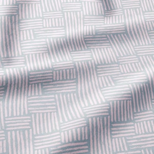 May include: A fabric featuring a repeating geometric pattern of light pink, hand-drawn style horizontal and vertical lines arranged in small rectangular blocks against a solid light gray background, creating a textured and woven visual effect.