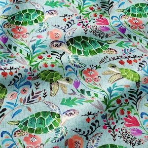 May include: A light blue fabric featuring a repeating pattern of green sea turtles swimming among colorful botanical illustrations, including red berries, pink flowers, and various green leafy stems and dark thin branches.