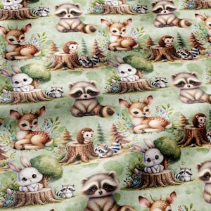 May include: A light green fabric featuring a repeating pattern of woodland animals including raccoons, deer, rabbits, and hedgehogs. The animals are depicted in a cartoon style, sitting on tree stumps or nestled among small green trees.