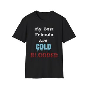 May include: Black t-shirt with white text that reads "My Best Friends Are COLD BLOODED" with the word "COLD" in blue and "BLOODED" in red.