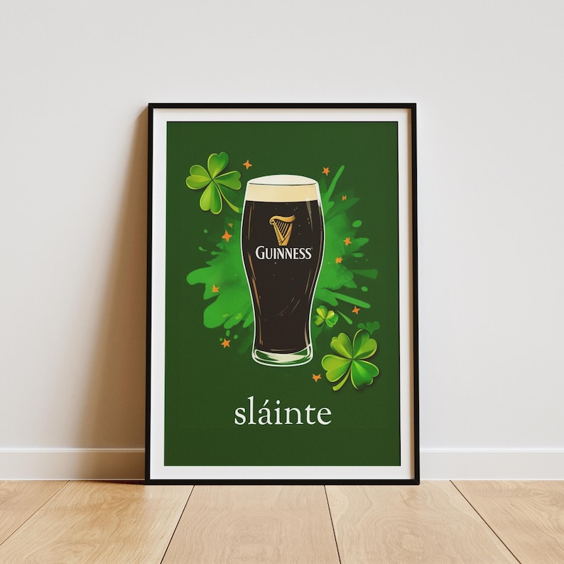 May include: A green poster featuring a glass of Guinness beer and shamrocks. The poster reads "sl&aacute;inte", which is Irish for "cheers".