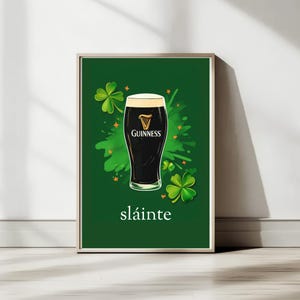 May include: A green poster featuring a glass of Guinness beer and shamrocks. The text "sl&aacute;inte" is printed below the glass.