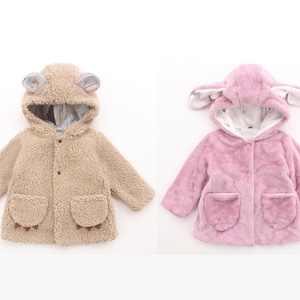 May include: Two children's coats. One is tan with a bear-like hood and paw-shaped pockets. The other is pink with a bunny-like hood and pockets. Both coats have a soft, fuzzy texture and button closures.