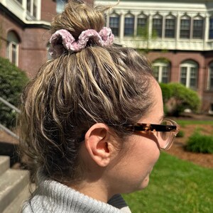 A pink velvet scrunchie