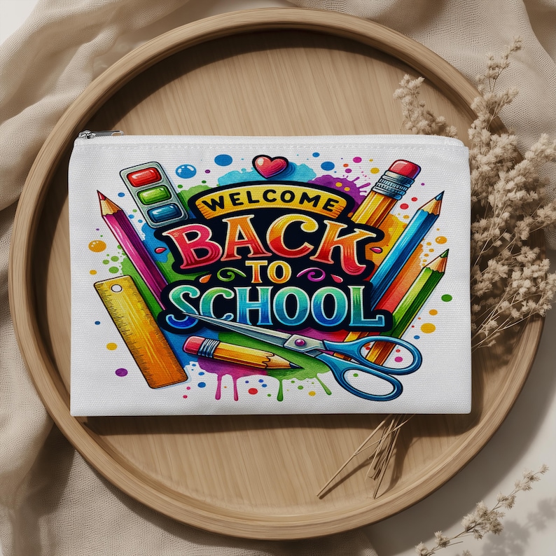 May include: A white rectangular zippered pouch featuring a colorful graphic print with the text "WELCOME BACK TO SCHOOL" in bold letters, surrounded by illustrations of pencils, a ruler, scissors, and a paint set against a vibrant paint splatter.