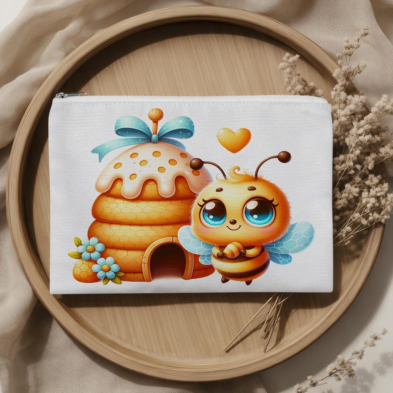 May include: A white rectangular zippered pouch featuring a cartoon illustration of a golden beehive topped with a light blue bow and a small bee with large blue eyes, blue wings, and a yellow heart floating above it, accented by small blue flowers.