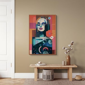 Puede incluir: Una impresión artística enmarcada que presenta un retrato estilizado. La obra de arte utiliza formas geométricas y una vibrante paleta de colores de verde azulado, naranja, rosa y negro. El retrato tiene un estilo moderno y artístico.