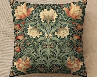 May include: A square throw pillow featuring a dense, symmetrical botanical pattern. The design displays large, pale yellow and orange tulip-like flowers intertwined with intricate, dark green foliage and stems against a deep, dark green background.