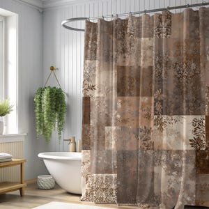 May include: A brown and beige patchwork shower curtain with floral and geometric patterns. The curtain hangs in front of a white bathtub, creating a warm and inviting bathroom atmosphere. The curtain is made of a semi-transparent material.