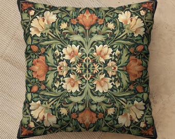 May include: A square throw pillow featuring a symmetrical botanical pattern with cream and burnt orange flowers set against a dark forest green background. The design includes intricate leafy vines and floral motifs arranged in a repeating layout.