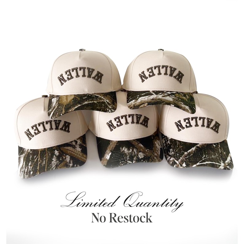 May include: A stack of six baseball caps with a cream-colored crown and a camouflage brim. The word "WALLEN" is embroidered in dark brown on the front of each cap. The text "Limited Quantity No Restock" is below the caps.