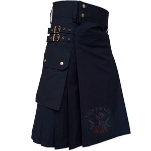 May include: A navy blue kilt with pleats, pockets, and adjustable straps with gold-colored buckles. The kilt has a logo that says "Kilts For Men".