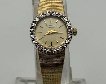 Vintage Caravelle by Bulova Womens P7 Diamond Bezel Gold Tone Quartz Watch