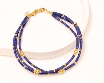 Pulseira de Lápis-lazúli em Ouro 14K: Joias artesanais em estilo egípcio com miçangas.