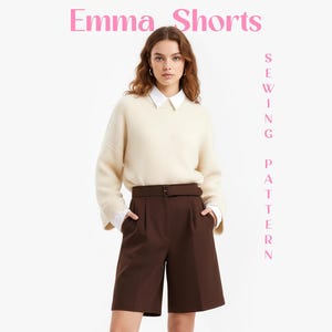 May include: A woman in a cream sweater, white collared shirt, and brown shorts with a belt. The shorts have pockets. Pink text at the top reads "Emma Shorts", with "Sewing Pattern" written vertically on the right.