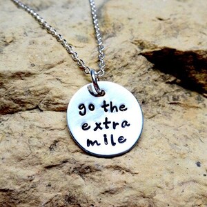 Go the extra mile sterling silver charm