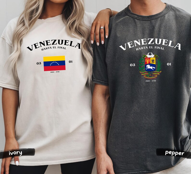 May include: Two t-shirts, one ivory and one pepper, featuring the word "VENEZUELA" above the phrase "HASTA EL FINAL." Each shirt displays a Venezuelan flag or coat of arms, along with the numbers "03" and "01."