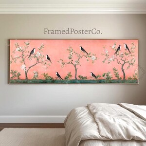 May include: A panoramic rectangular wall art print featuring a coral pink background with black and white birds perched on flowering tree branches. The artwork displays delicate white blossoms and green foliage, with the text FramedPosterCo. above.