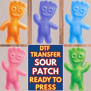 May include: A collection of six colorful Sour Patch Kids DTF (Direct to Film) transfers. The transfers include orange, purple, blue, pink, and green Sour Patch Kids. A blue rectangle displays the text "DTF TRANSFER SOUR PATCH READY TO PRESS."