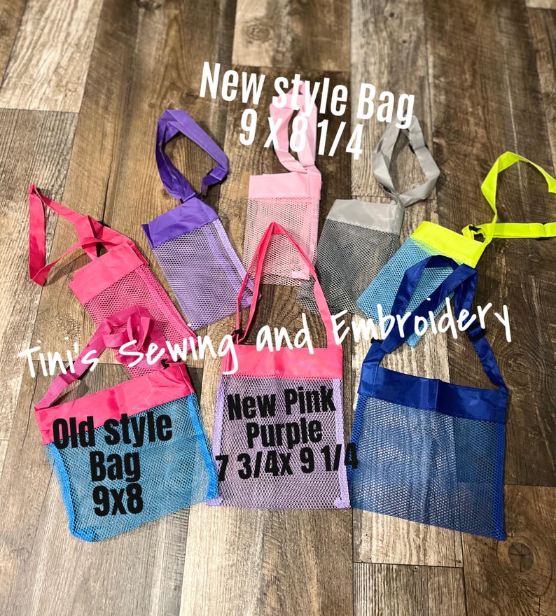 May include: A collection of mesh tote bags in various colors, including pink, purple, blue, and gray. The bags have fabric tops and straps. Text on the bags reads "New style Bag 9 x 8 1/4", "Old style Bag 9x8", and "New Pink Purple 7 3/4x 9 1/4".