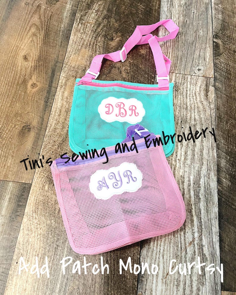May include: Two mesh zippered bags with adjustable straps. The turquoise bag has the initials "DBR" embroidered on it. The pink bag has the initials "NYR" embroidered on it.