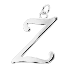 May include: A shiny silver pendant in the shape of the letter "Z". The capital letter has a cursive design with a loop at the top and bottom. A small loop is at the top for attaching to a chain or bracelet. The pendant is set against a white background.
