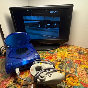 May include: A white ceramic mug with a black handle and the text "But First, Coffee" in a handwritten style. The mug is on a white surface. The mug is approximately 4 inches tall.