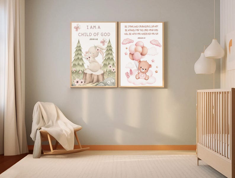 Framed set of two scripture wall arts hung in a nursery above a rocking chair and crib. Bunny art with John 1:12 and teddy bear with Joshua 1:9 styled with warm lighting and neutral decor.