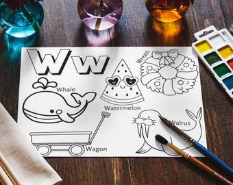 May include: A black and white printable coloring page featuring the letter W and various words starting with the letter W, including whale, watermelon, wreath, wagon, and walrus. 