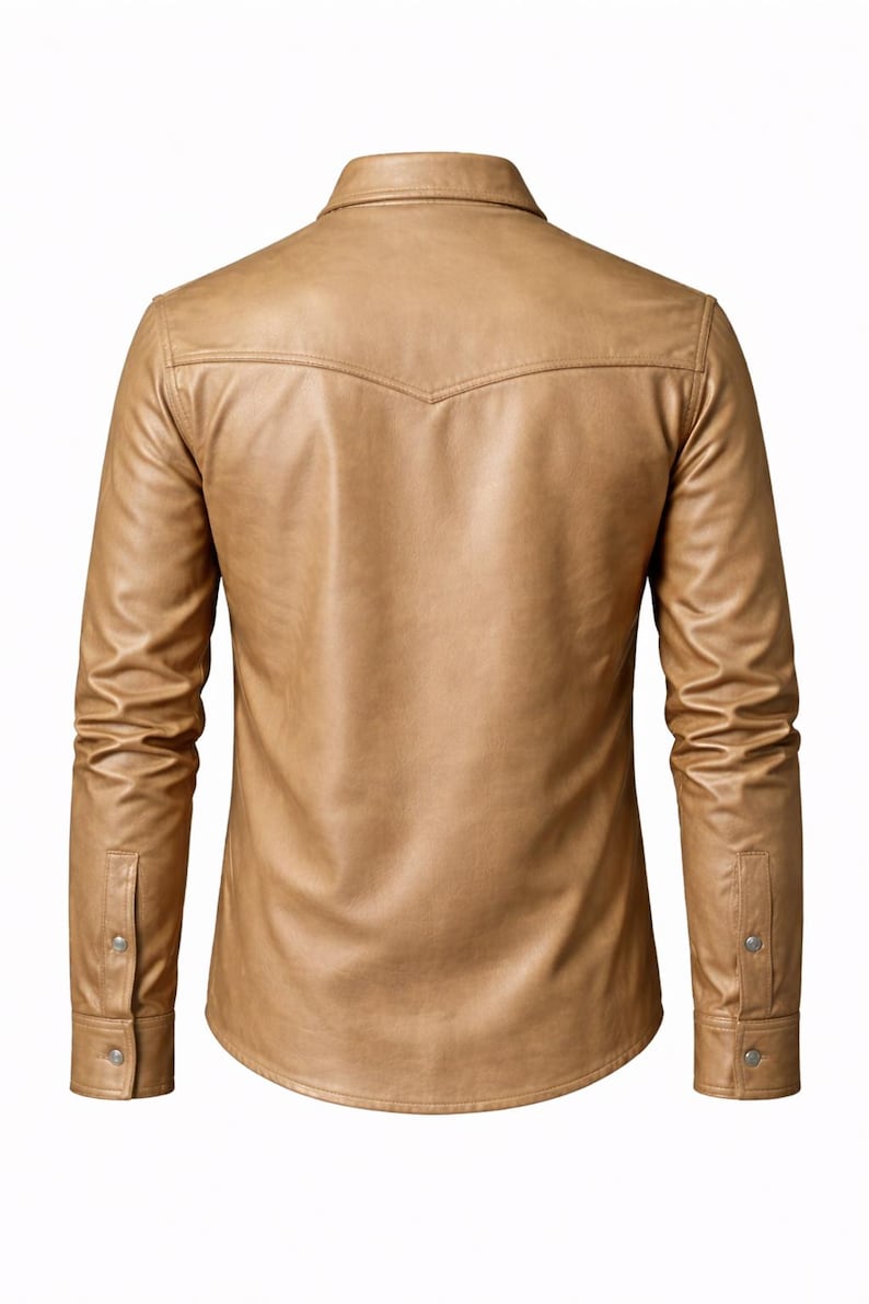 May include: A tan, long-sleeved shirt made of faux leather. The shirt has a classic collar, buttoned cuffs, and a decorative yoke on the back. The shirt is a neutral color and has a tailored fit.