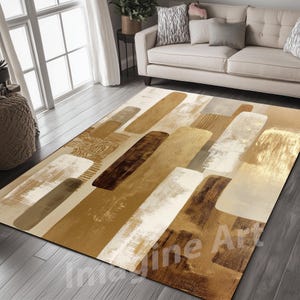 May include: A rectangular area rug with an abstract design. The rug features a pattern of overlapping, elongated shapes in shades of brown, beige, and white. The design has a textured, brushstroke appearance, creating a modern aesthetic. The rug is placed on a wooden floor.